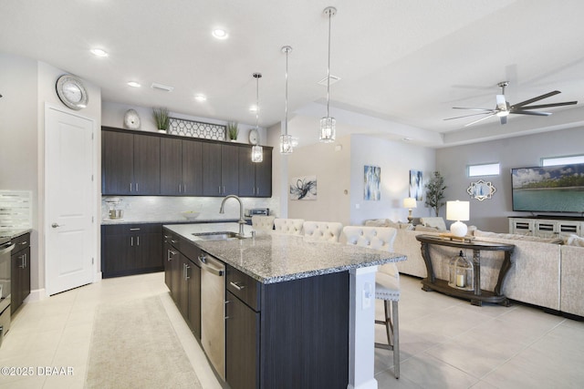6279 W Fallsgrove Ln, Port Orange, FL 32128 - kitchen featuring a kitchen breakfast bar, open floor plan, light tile patterned flooring, dishwasher, and recessed lighting