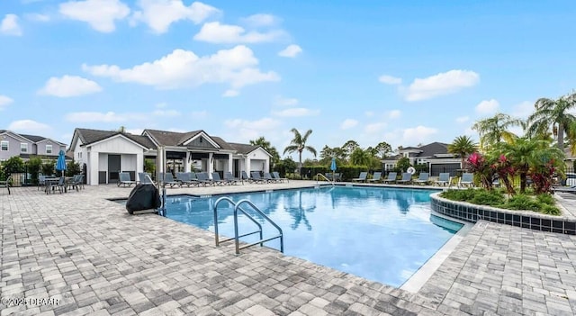 6279 W Fallsgrove Ln, Port Orange, FL 32128 - community pool featuring a patio area and a residential view