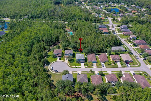 10 Cantilever Ct, Ormond Beach, FL 32174 - aerial view of property and surrounding area with a heavily wooded area, a large body of water, and nearby suburban area