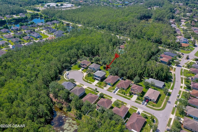 10 Cantilever Ct, Ormond Beach, FL 32174 - view of property location featuring a forest, nearby suburban area, and a large body of water