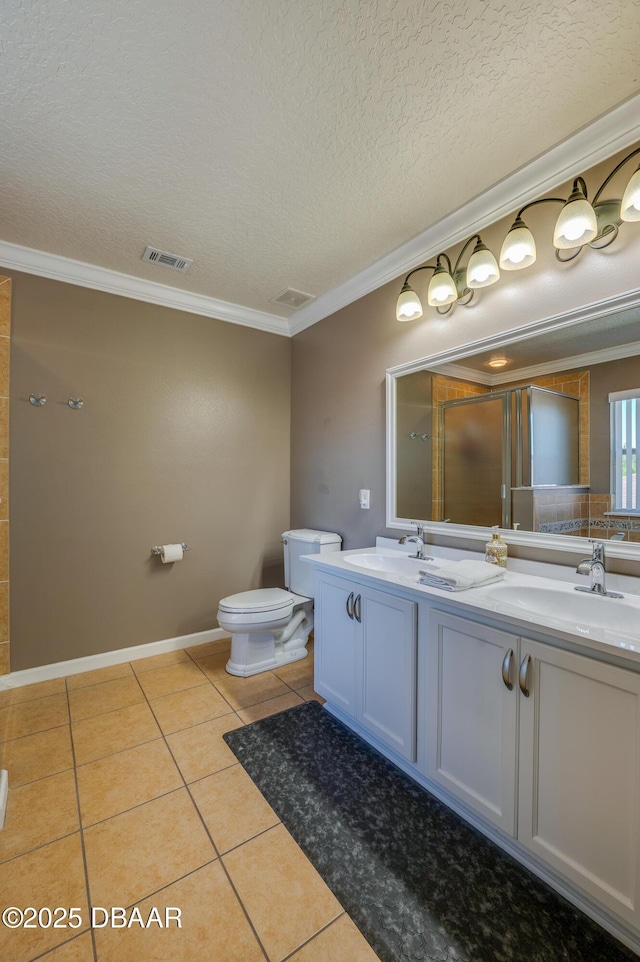 10 Cantilever Ct, Ormond Beach, FL 32174 - bathroom with toilet, double vanity, tile patterned flooring, a textured ceiling, and ornamental molding