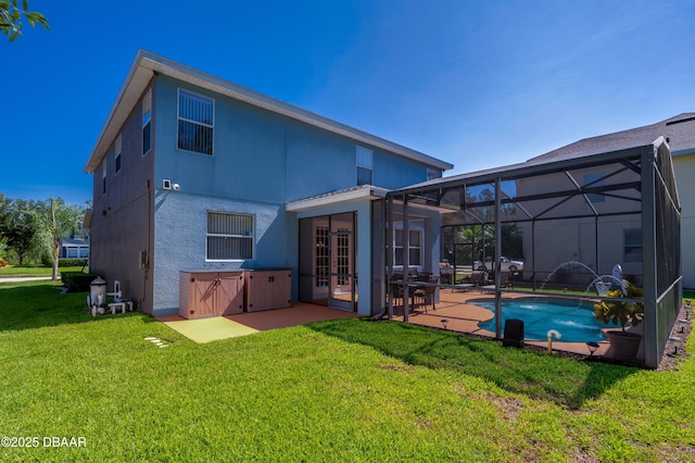 10 Cantilever Ct, Ormond Beach, FL 32174 - rear view of property with a patio area, stucco siding, french doors, a lawn, and an outdoor pool