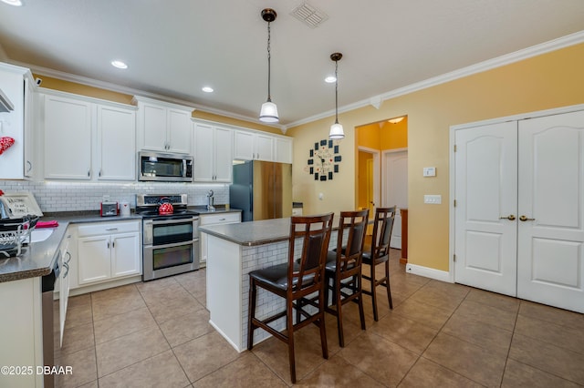 10 Cantilever Ct, Ormond Beach, FL 32174 - kitchen featuring appliances with stainless steel finishes, crown molding, dark countertops, backsplash, and light tile patterned floors