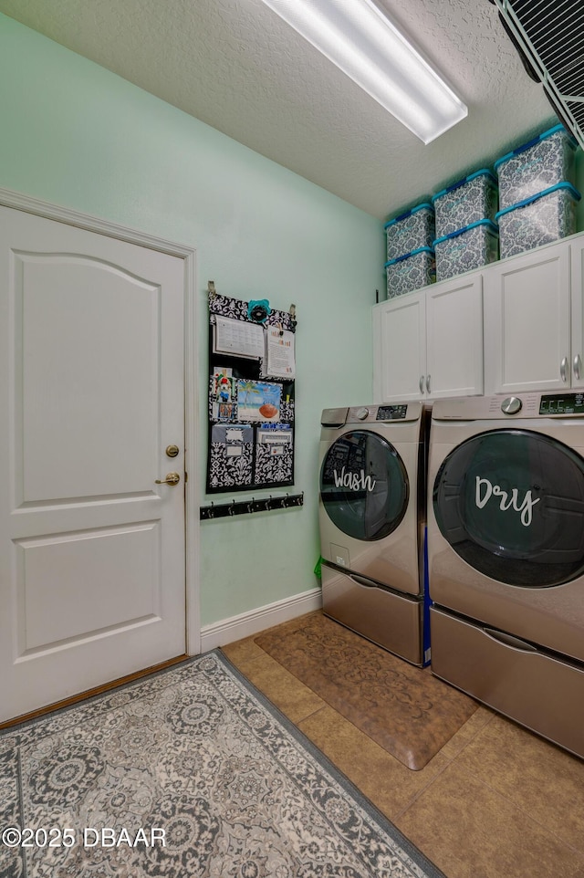 10 Cantilever Ct, Ormond Beach, FL 32174 - laundry area featuring cabinet space, washer and clothes dryer, a textured ceiling, and baseboards