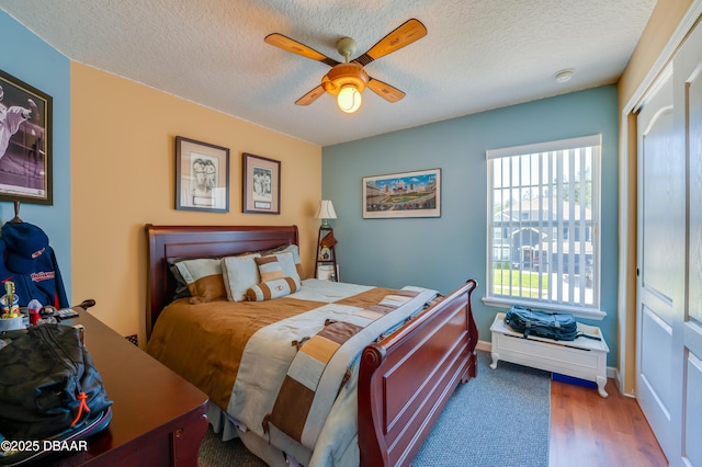 10 Cantilever Ct, Ormond Beach, FL 32174 - bedroom with a textured ceiling, a ceiling fan, a closet, and wood finished floors