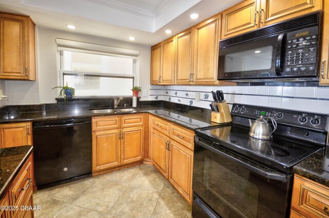 4435 S Atlantic Ave Unit 416, Ponce Inlet, FL 32127 - kitchen featuring black appliances, crown molding, brown cabinets, dark stone countertops, and recessed lighting
