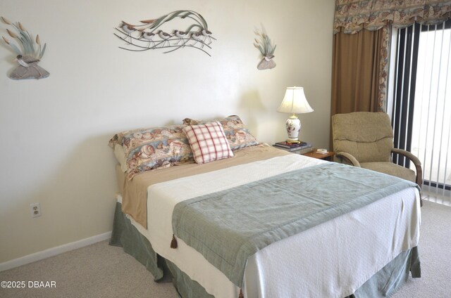 4435 S Atlantic Ave Unit 416, Ponce Inlet, FL 32127 - carpeted bedroom featuring baseboards