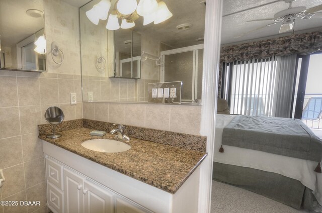 4435 S Atlantic Ave Unit 416, Ponce Inlet, FL 32127 - full bathroom with a ceiling fan, vanity, and a shower with shower door