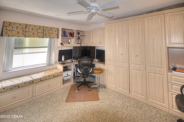 4435 S Atlantic Ave Unit 416, Ponce Inlet, FL 32127 - home office featuring ceiling fan, built in desk, and a textured ceiling