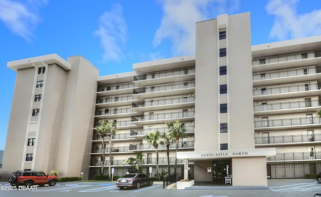 4435 S Atlantic Ave Unit 416, Ponce Inlet, FL 32127 - view of apartment building / complex with uncovered parking