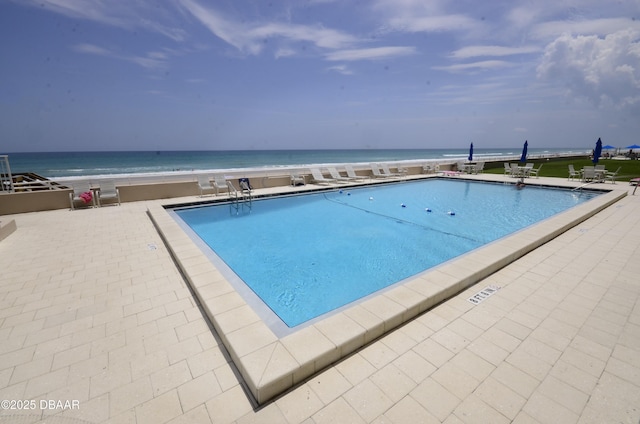 4435 S Atlantic Ave Unit 416, Ponce Inlet, FL 32127 - community pool featuring a patio area and a water view