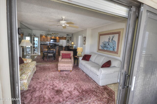 4435 S Atlantic Ave Unit 416, Ponce Inlet, FL 32127 - living area featuring a ceiling fan and carpet floors