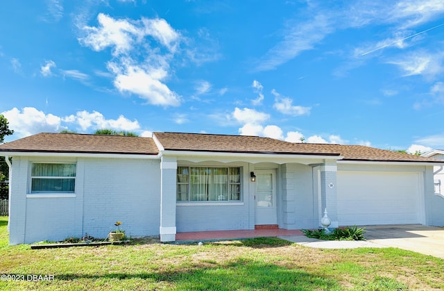 single story home featuring a garage, a front yard, and covered porch