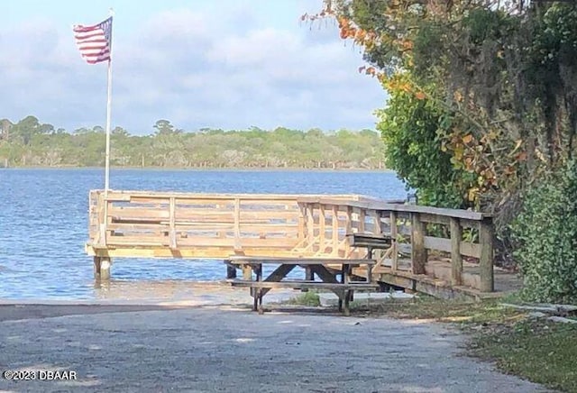 view of dock with a water view