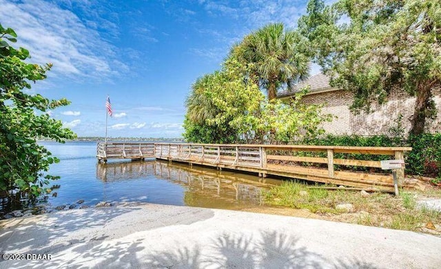 dock area with a water view