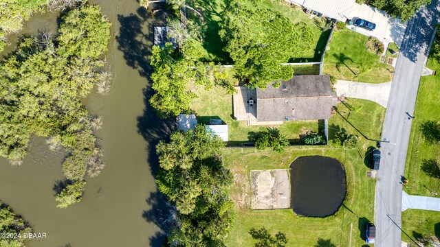 drone / aerial view with a water view