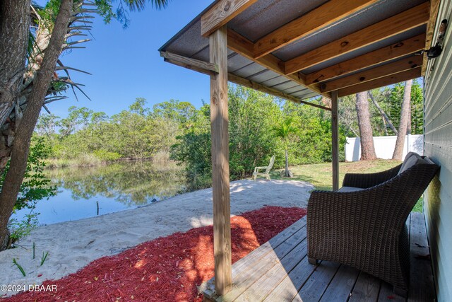 wooden deck with a water view