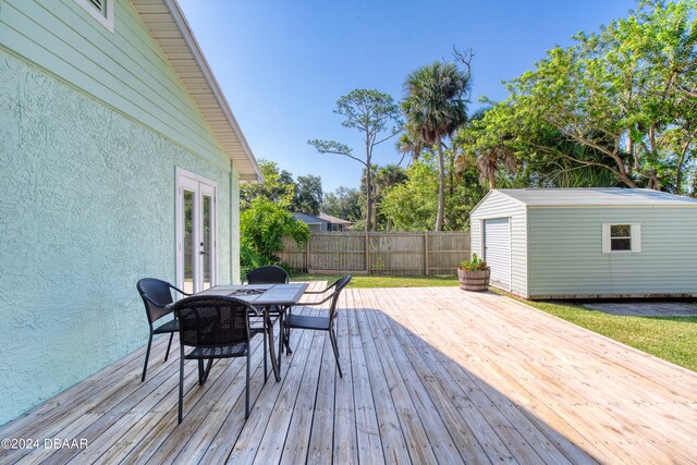 wooden deck with a shed