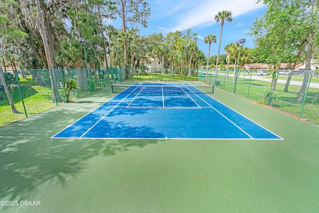 view of sport court with fence