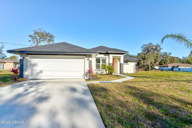 view of front of house with a front yard and a garage