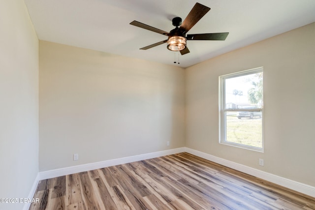 unfurnished room featuring light hardwood / wood-style floors and ceiling fan