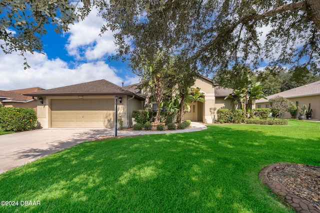 view of front of property featuring a front lawn and a garage