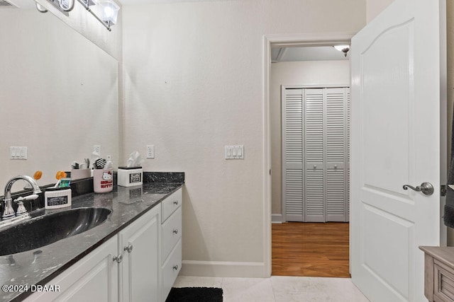 bathroom featuring vanity and hardwood / wood-style flooring