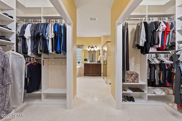 spacious closet featuring tile patterned floors