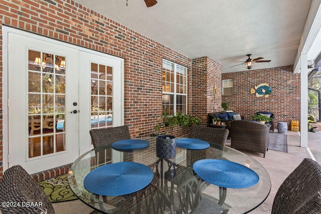 view of patio featuring french doors and ceiling fan