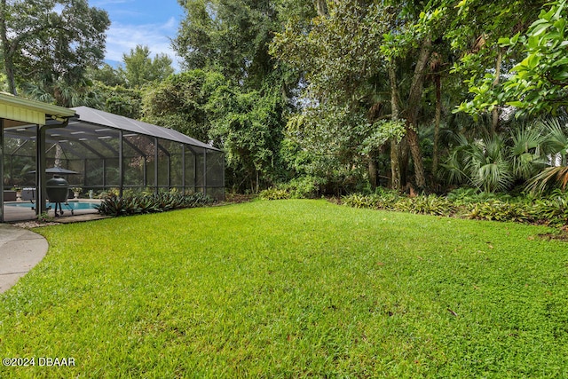 view of yard with a lanai