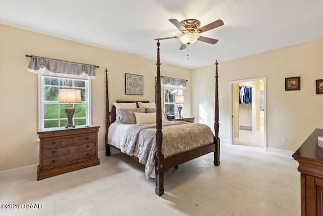 bedroom featuring a spacious closet and ceiling fan