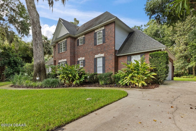 view of side of home featuring a yard