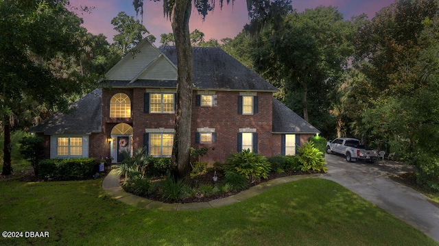 view of front of house with a lawn