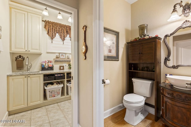 bathroom with tile patterned floors, vanity, and toilet