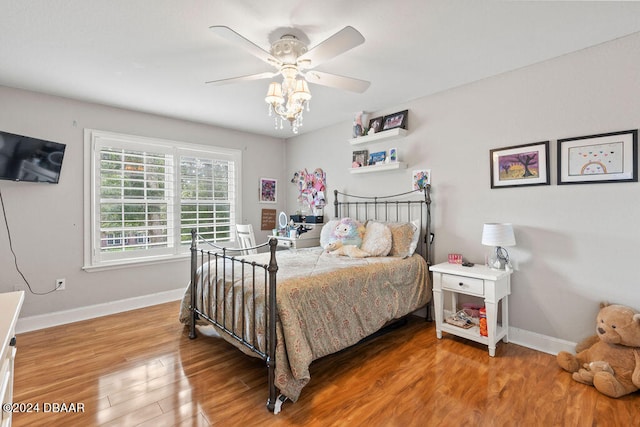 bedroom featuring hardwood / wood-style flooring and ceiling fan