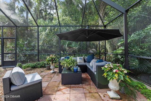 view of patio with outdoor lounge area and a lanai