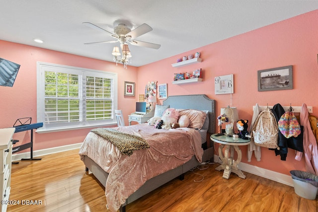 bedroom featuring light hardwood / wood-style flooring and ceiling fan