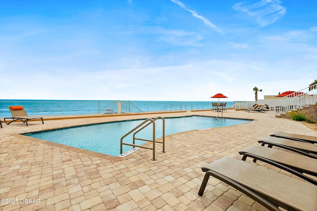 3343 S Atlantic Ave Unit 601, Daytona Beach Shores, FL 32118 - community pool featuring a patio