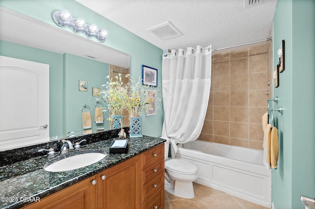 3343 S Atlantic Ave Unit 601, Daytona Beach Shores, FL 32118 - full bathroom featuring vanity, shower / tub combo with curtain, tile patterned floors, and a textured ceiling