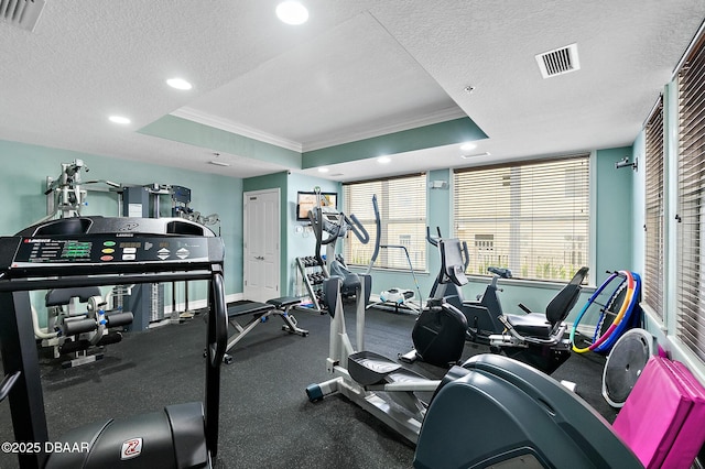 3343 S Atlantic Ave Unit 601, Daytona Beach Shores, FL 32118 - exercise room featuring ornamental molding, a tray ceiling, a textured ceiling, and recessed lighting