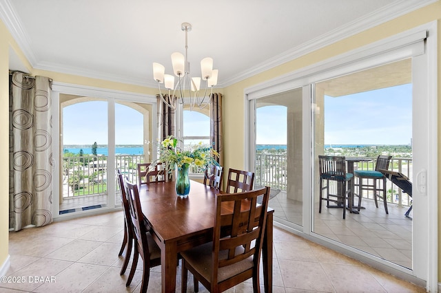 3343 S Atlantic Ave Unit 601, Daytona Beach Shores, FL 32118 - dining area with a chandelier, ornamental molding, a water view, and light tile patterned floors