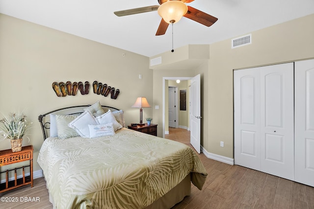 3343 S Atlantic Ave Unit 601, Daytona Beach Shores, FL 32118 - bedroom with wood finished floors, a closet, and ceiling fan