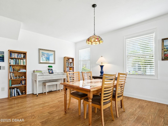 206 S Riverside Dr, Edgewater, FL 32132 - dining room with light wood-type flooring and ornamental molding