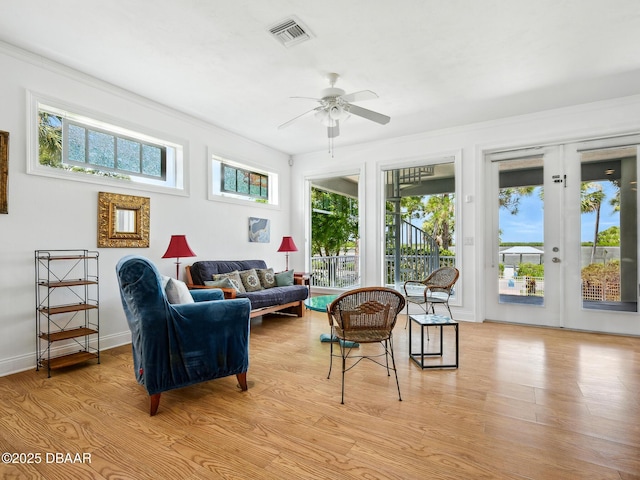 206 S Riverside Dr, Edgewater, FL 32132 - living room with ceiling fan, light wood-style flooring, and crown molding