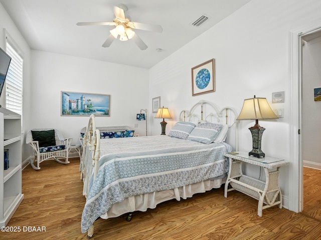 206 S Riverside Dr, Edgewater, FL 32132 - bedroom featuring wood finished floors and ceiling fan