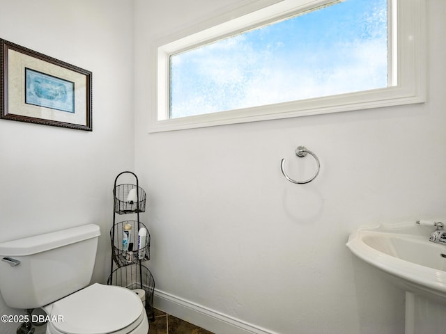 206 S Riverside Dr, Edgewater, FL 32132 - bathroom featuring toilet and baseboards