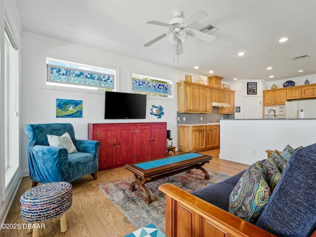 206 S Riverside Dr, Edgewater, FL 32132 - living area featuring light wood-style flooring, recessed lighting, ceiling fan, and ornamental molding