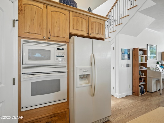 206 S Riverside Dr, Edgewater, FL 32132 - kitchen featuring white appliances and light wood-type flooring