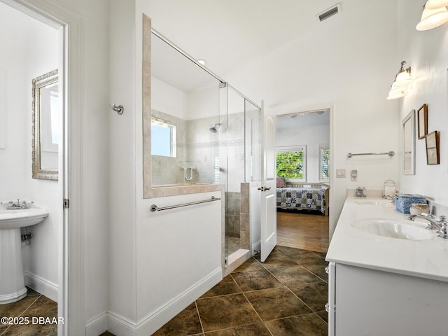 206 S Riverside Dr, Edgewater, FL 32132 - bathroom with a shower stall, double sink, and ensuite bath
