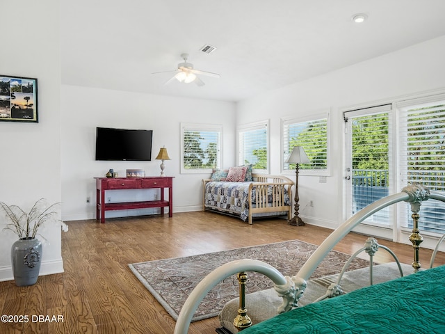 206 S Riverside Dr, Edgewater, FL 32132 - bedroom featuring access to outside, wood finished floors, and a ceiling fan